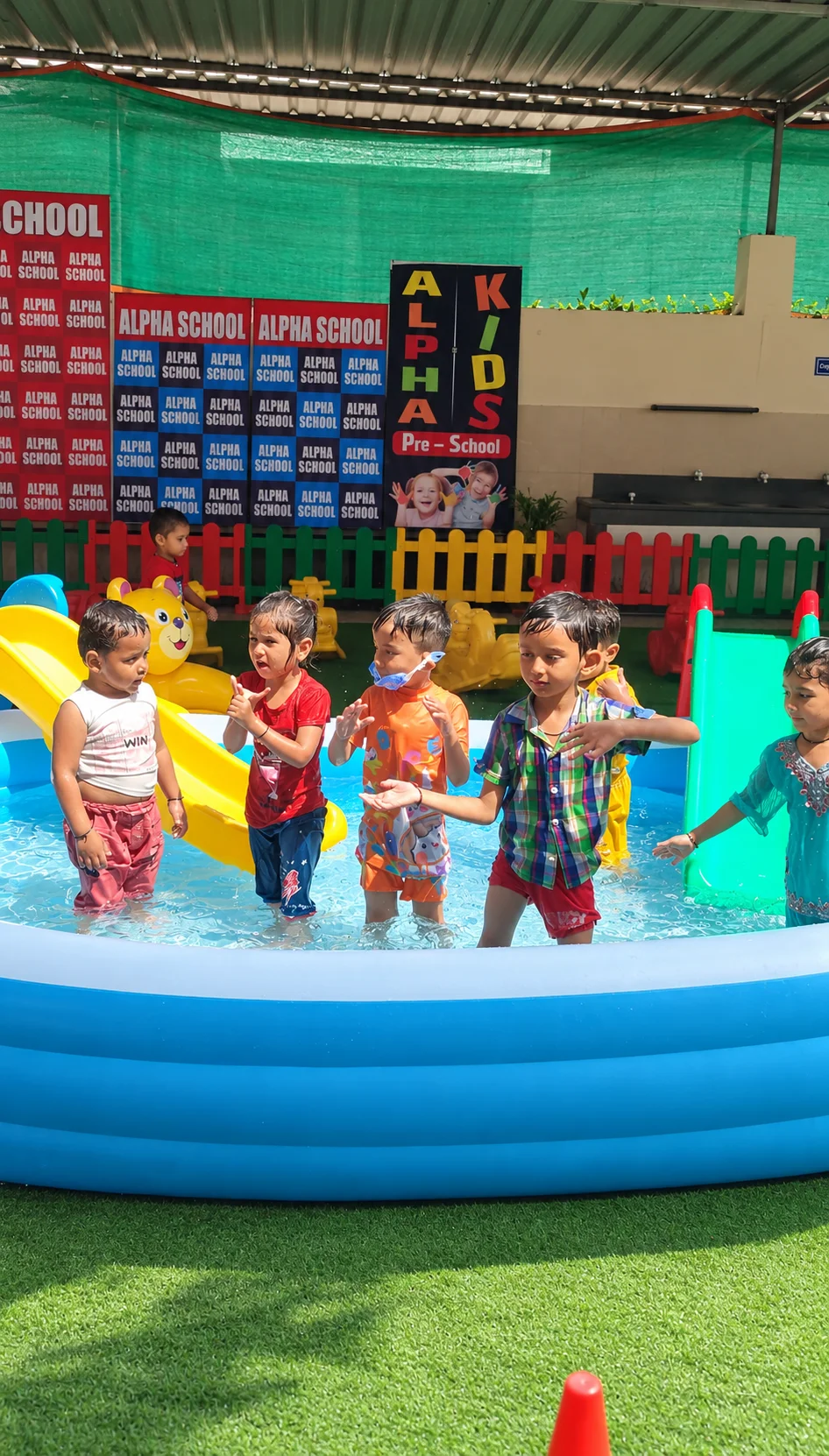 Children enjoying the supervised splash pool at Alpha Kids